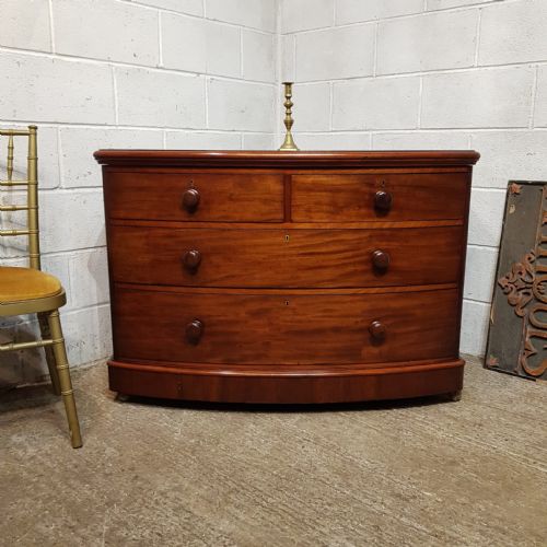 A VICTORIAN MAHOGANY 3 HEIGHT BOW FRONTED CHEST OF DRAWERS C1880