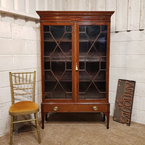 A REGENCY MAHOGANY ASTRAGAL GLAZED BOOKCASE ON STAND C1810