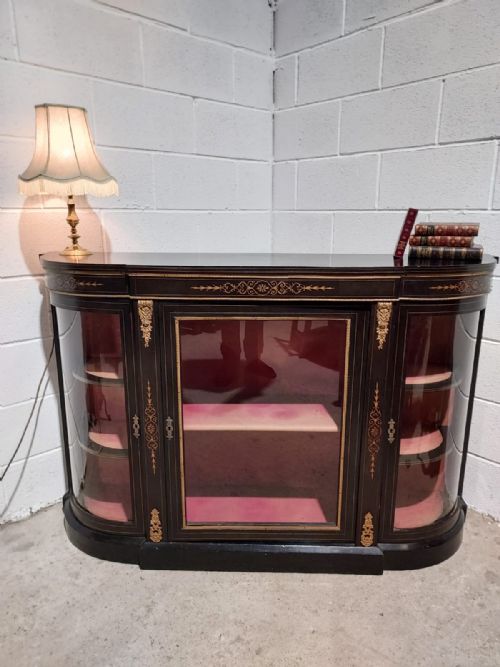 A 19TH CENTURY EBONISED AND GILT MOUNTED CREDENZA