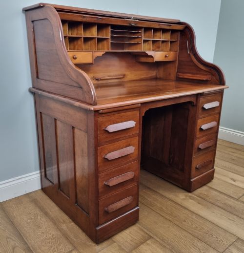 AN ANTIQUE WALNUT DESK BY THE BOSTON CHAIR COMPANY OF MASSACHUSETTS CIRCA 1885