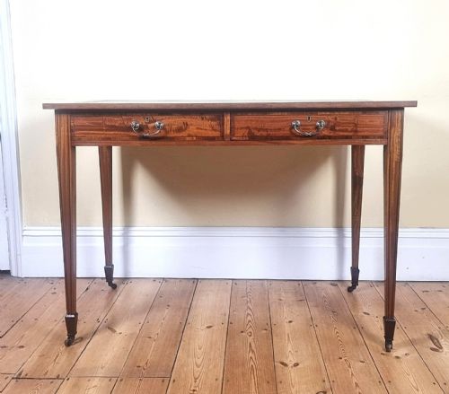 AN ANTIQUE 'SATINWOOD' WRITING TABLE WITH TULIPWOOD BANDED DECORATION