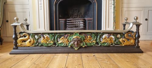 A MAGNIFICENT VICTORIAN POLYCHROMED FIREPLACE FENDER