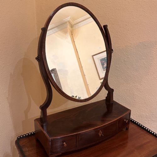 GEORGIAN BOWFRONTED FLAME MAHOGANY OVAL TOILET MIRROR