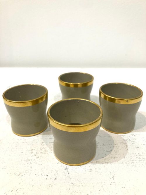 FOUR 1820'S WEDGWOOD DRABWARE EGG CUPS